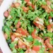 Easy Fermented Pico De Gallo Salsa recipe - A brown basket with white onions, yellow lemons, red tomatoes, and green jalapenos.