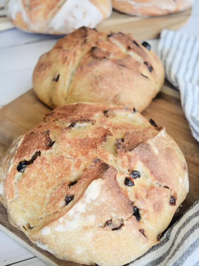 Fresh baked bread for Best Sourdough Bread Recipe with Almond and Raisins.