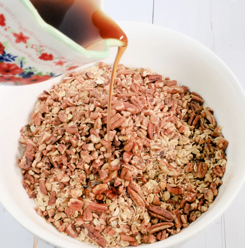 Ingredients mixed in a white bowl for Best Healthy Homemade Granola (Quick and Easy Recipe).