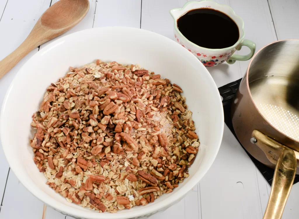 Ingredients mixed in a white bowl for Best Healthy Homemade Granola (Quick and Easy Recipe).