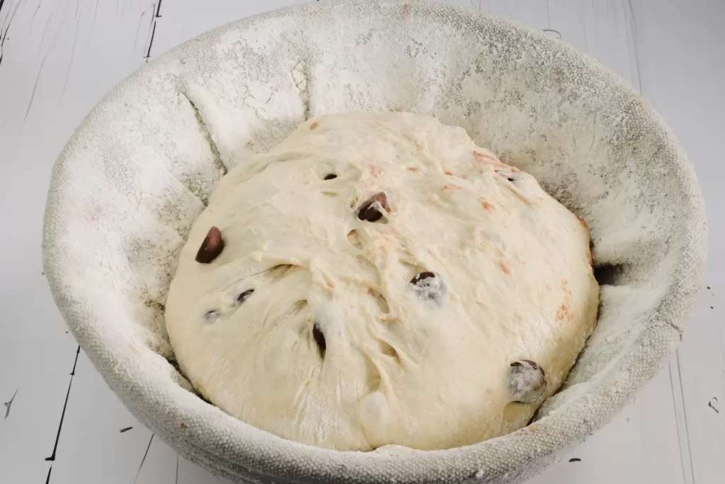 Sourdough in a banneton for Chocolate Chip Swirl Artisan Sourdough Bread Recipe.