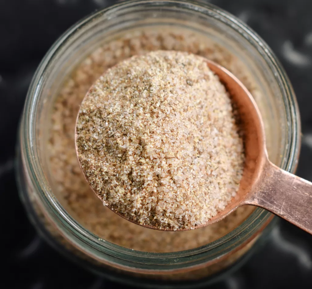 A tablespoon of The Perfect Dry Rub Recipe for the Best Pulled Pork.