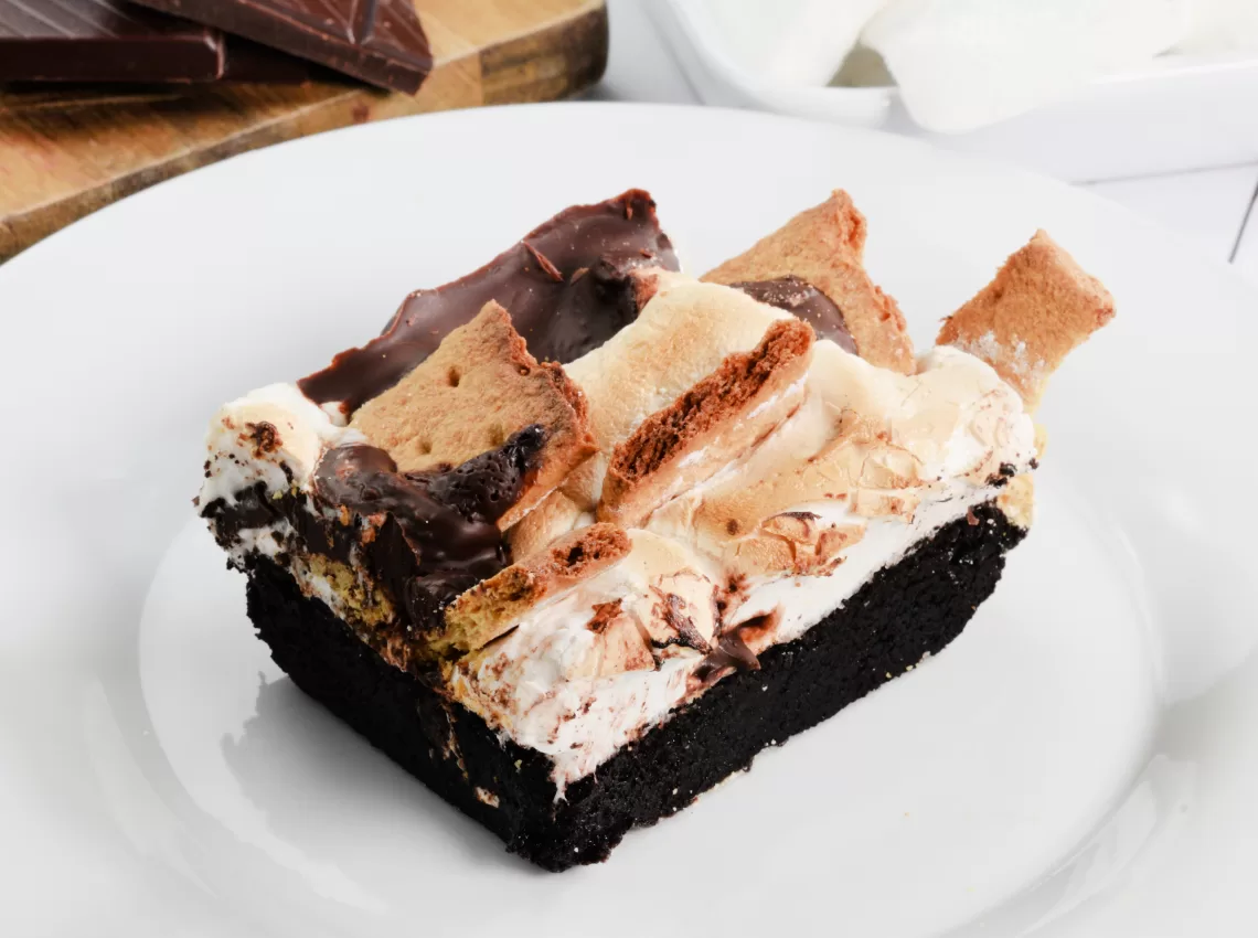 A s'mores brownies on a white plate for How to Make Easy Homemade S'mores Brownies Recip.