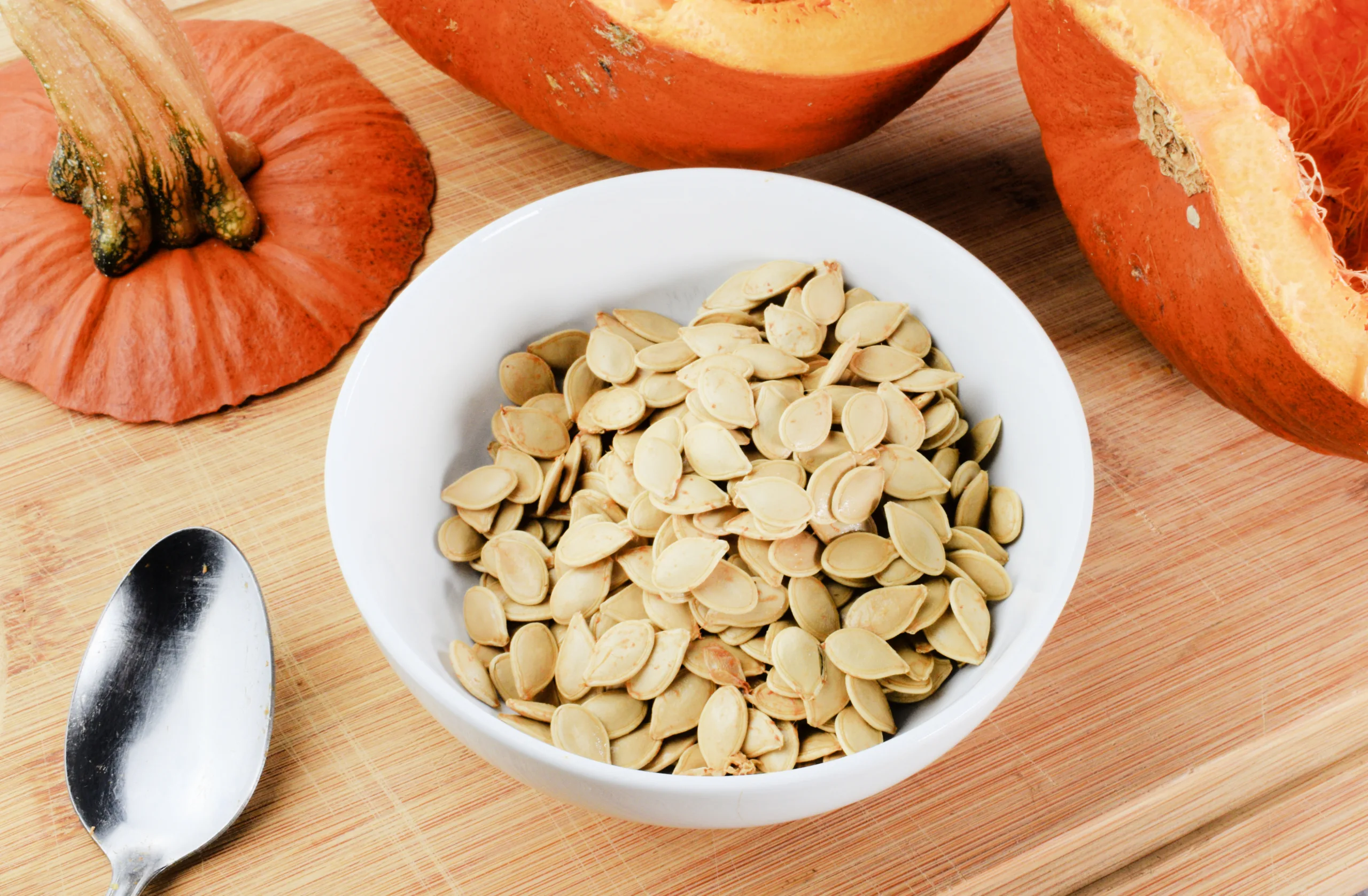 Seeds in a bowl for The Perfect Recipe for How to Roast Pumpkin Seeds.