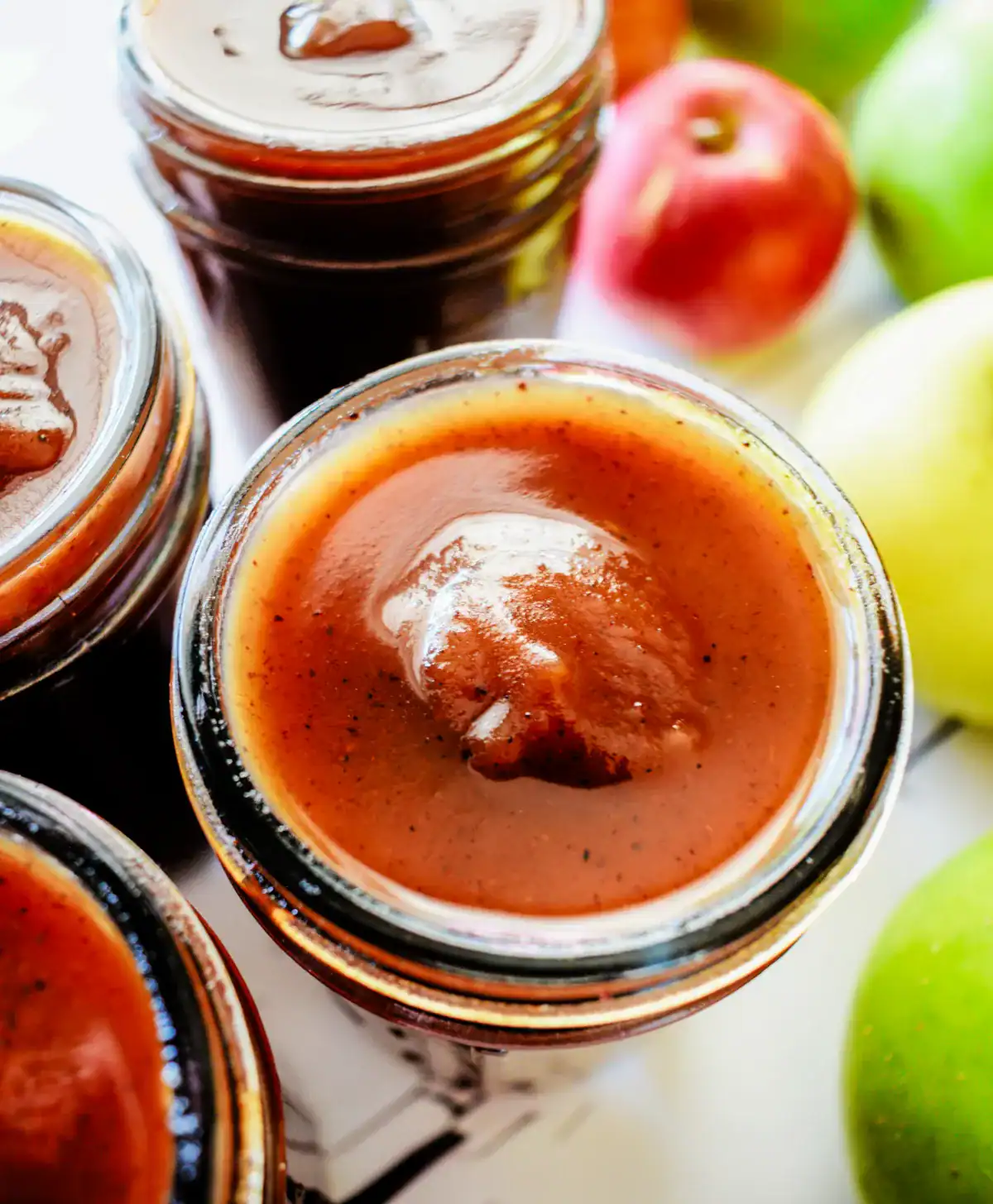 Homemade apple butter in jars for Best Homemade Old Fashioned Apple Butter Recipe.