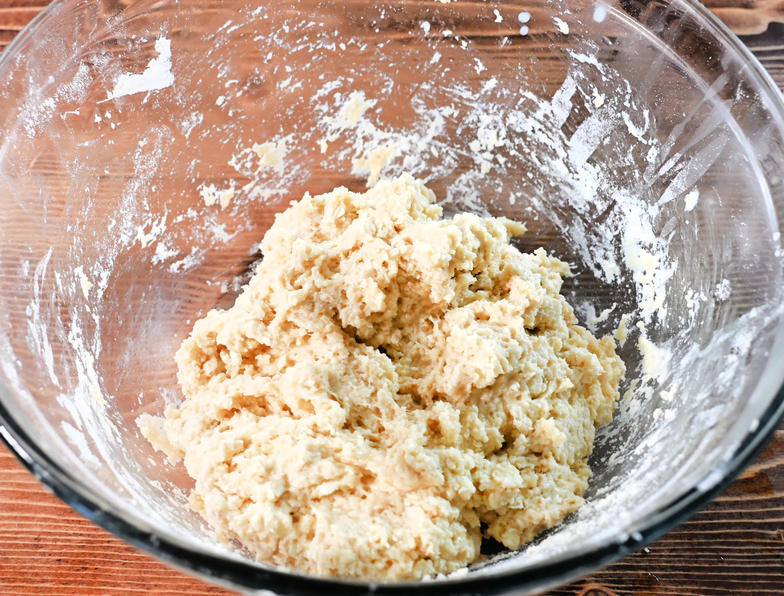 Soft, slightly sticky sourdough discard scone dough in a glass bowl, ready for berries