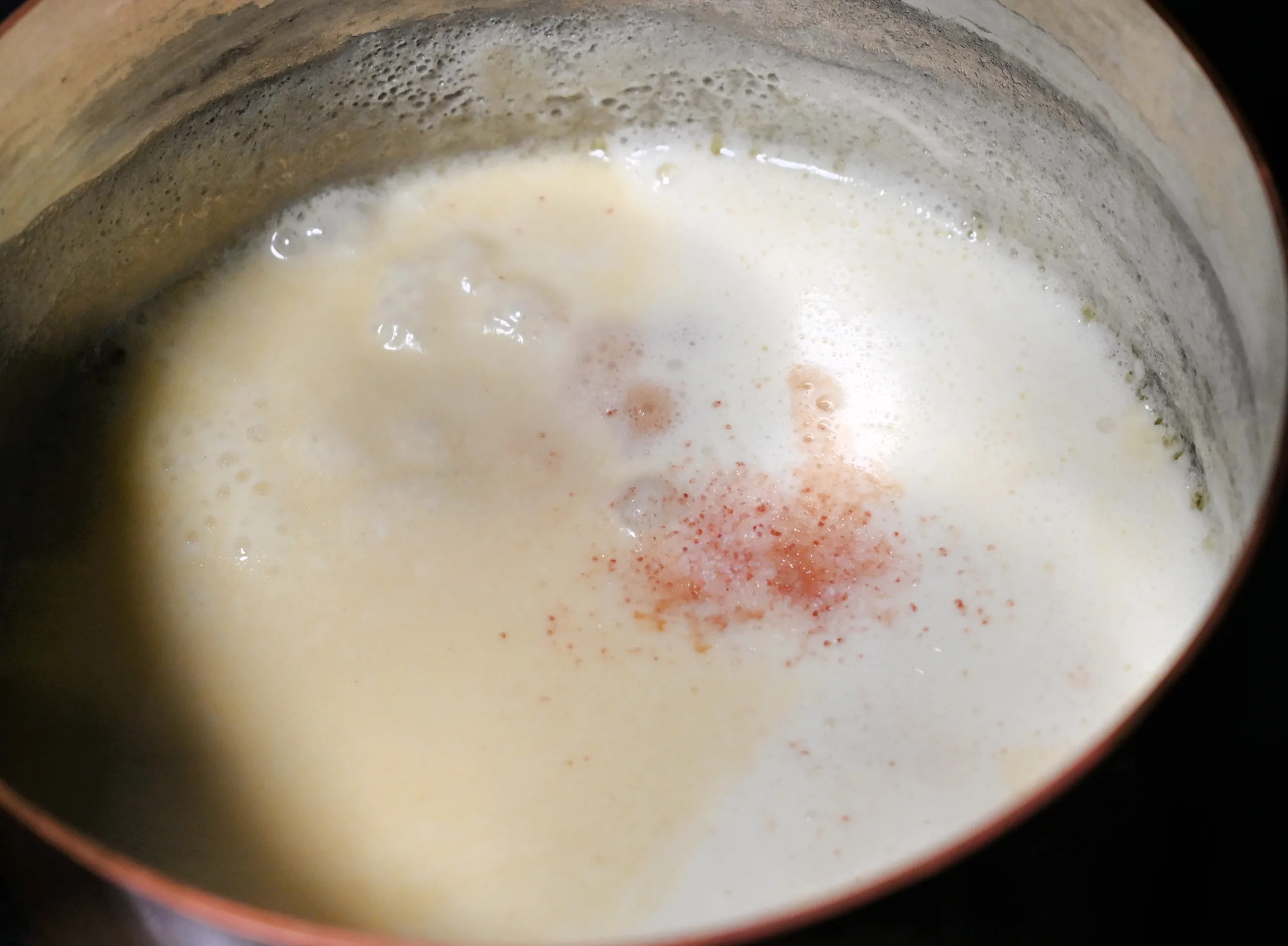 Cream, vanilla, salt, and sugar measured out for homemade soft caramel sauce