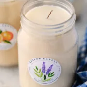 Homemade beef tallow candle in a mason jar labeled with lavender essential oil – clean-burning natural candle with a rustic and eco-friendly look.