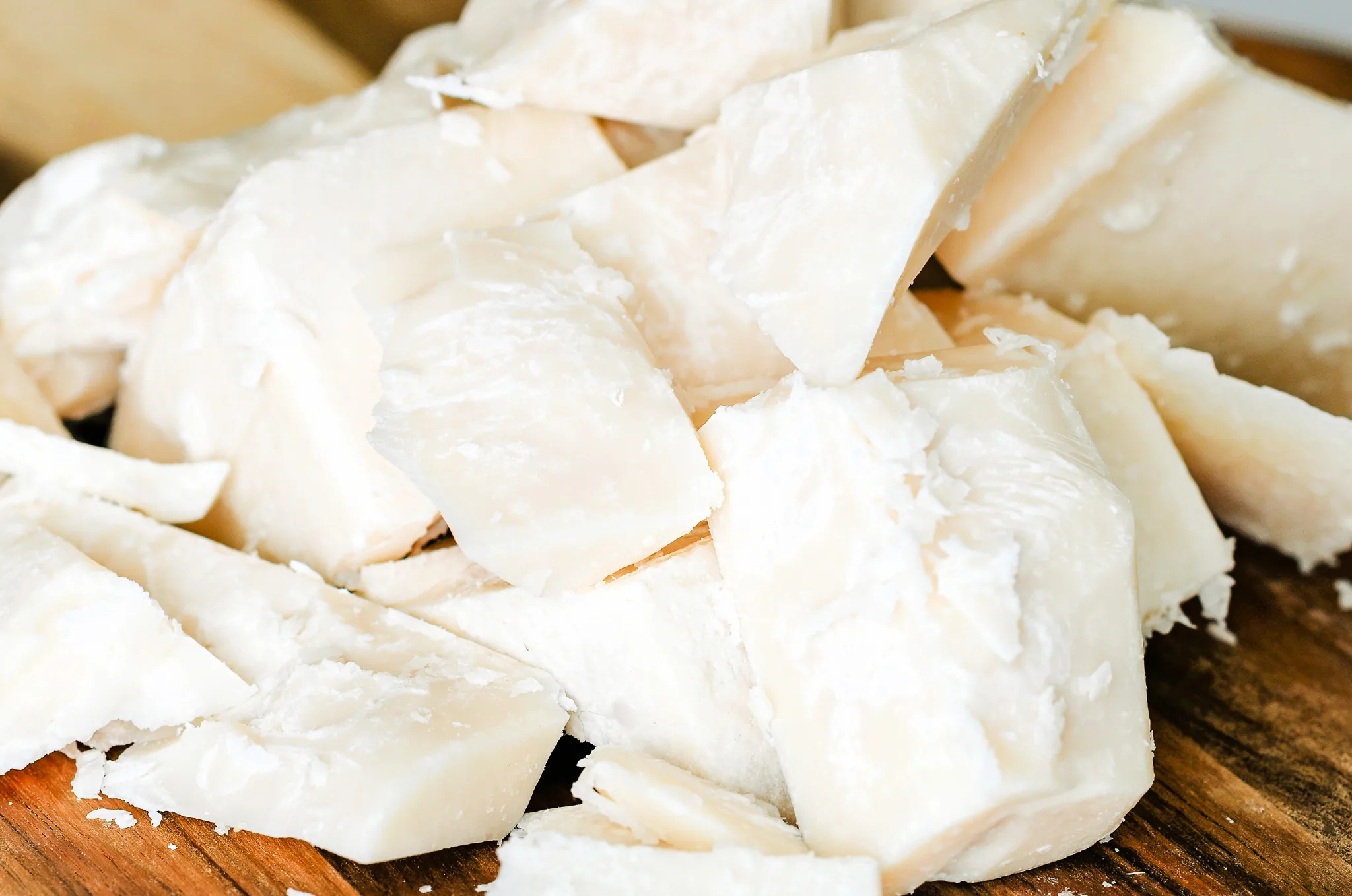 Close-up of rough-cut beef tallow pieces showing texture and natural color before purification.