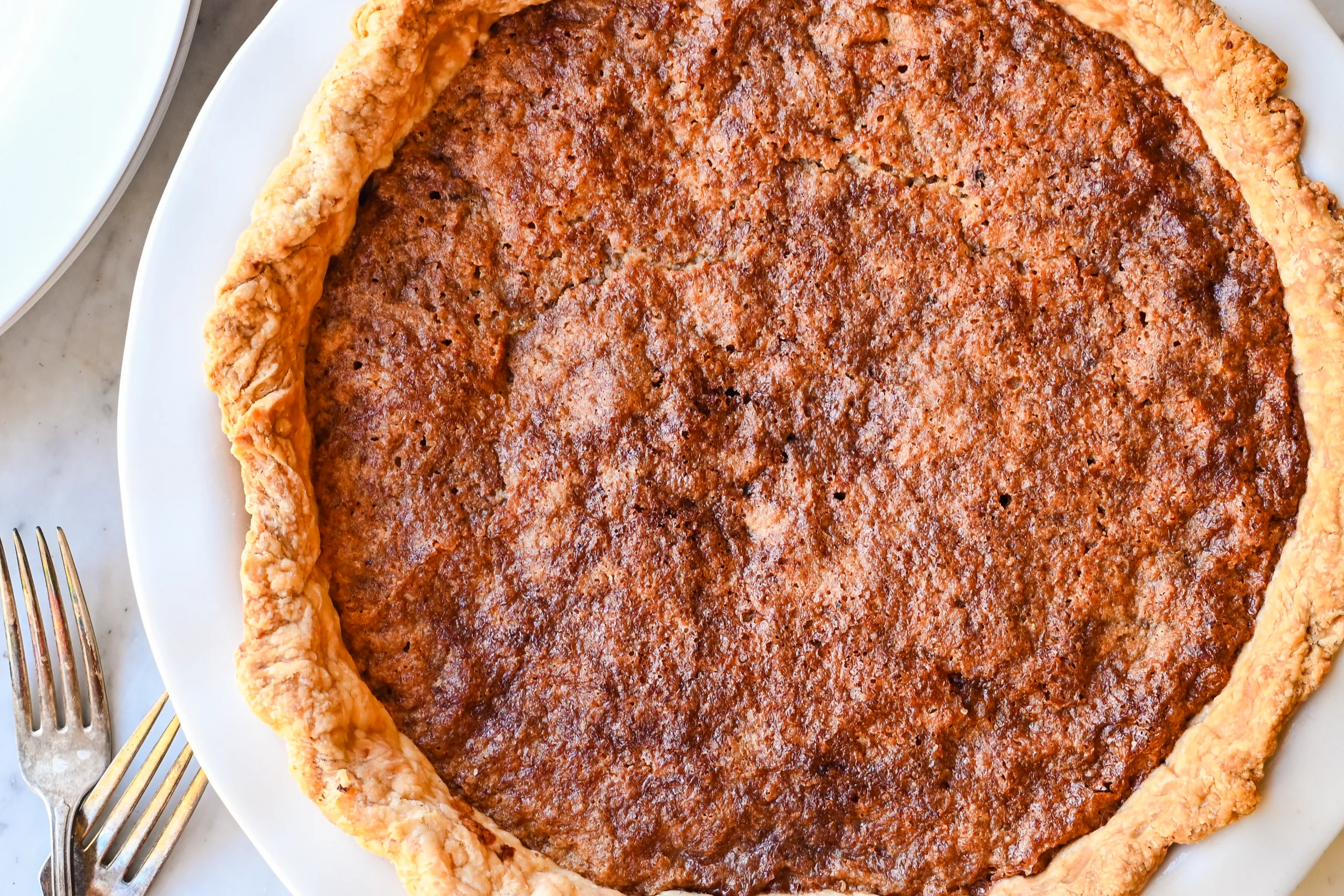 Golden-brown baked Pennsylvania Dutch Funny Cake with a crisp crust and chocolatey base.