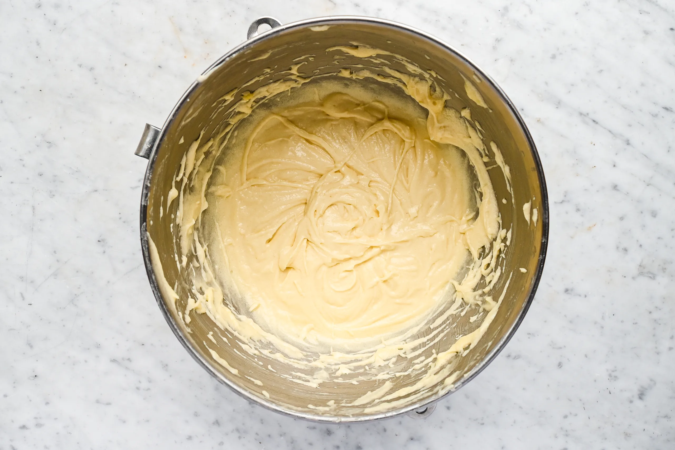 Smooth vanilla cake batter mixed and ready to pour into the unbaked pie crust for Funny Cake.