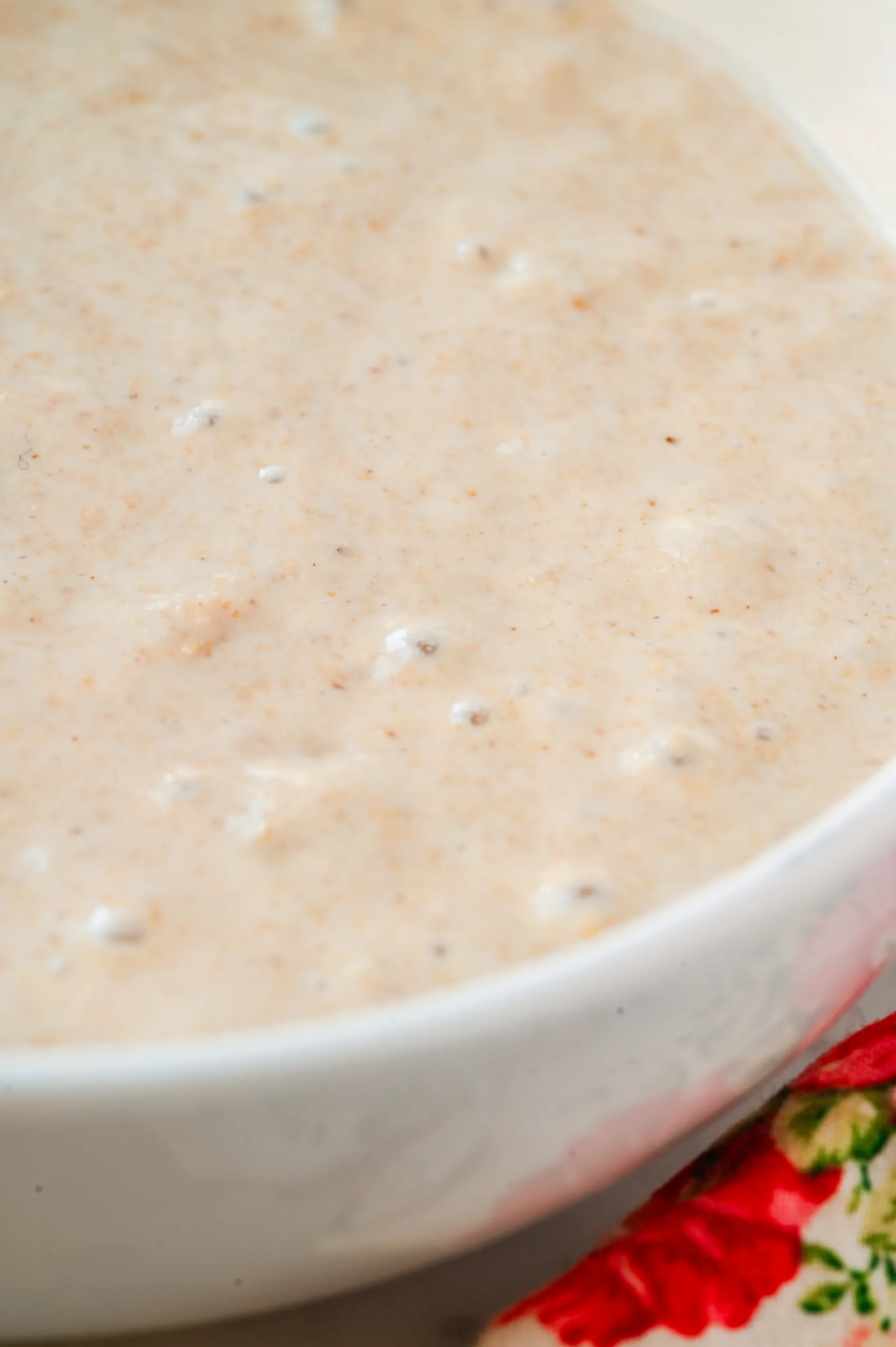 Creamy sourdough discard with small fermentation bubbles, ready to use in quick bread or pancake recipes.