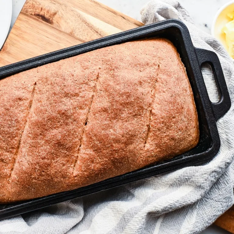 Fresh milled whole grain spelt bread baked in a loaf pan with a golden brown crust.