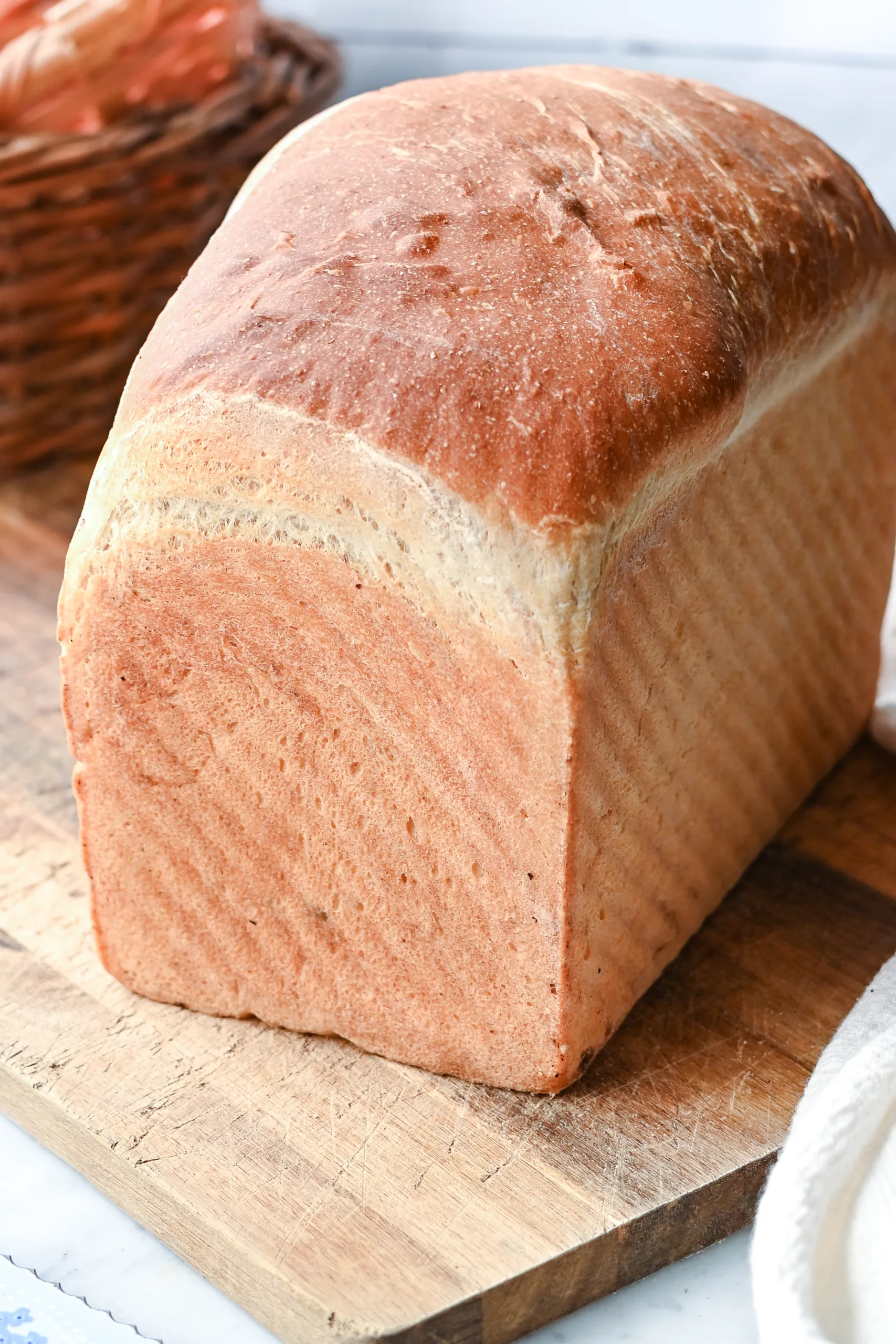 Homemade sourdough discard sandwich bread sliced open to reveal a soft, fluffy interior crumb.